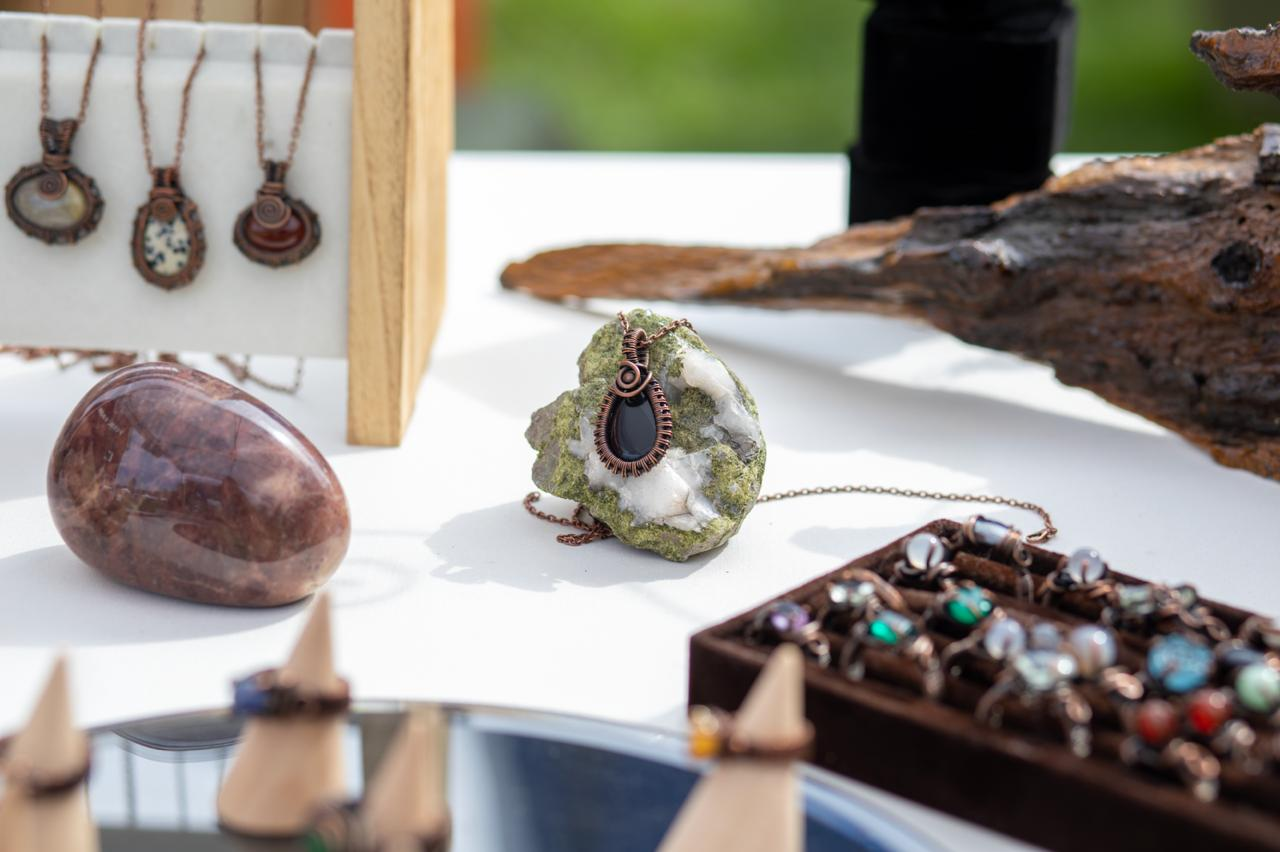 Tammy's jewelry, rocks, and tools at a craft fair booth